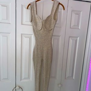 Body suit, low cut back , tight fitted and super stretchy